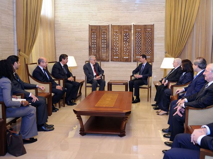 A handout picture released by the Syrian Arab News Agency (SANA) shows Syrian President Bashar al-Assad (L) meeting with International peace envoy Lakhdar Brahimi (R) in Damascus, on September 15, 2012. Brahimi warned after the meeting that the worsening conflict in Syria poses a threat to the region and the world. AFP PHOTO/HO/SANA == RESTRICTED TO EDITORIAL USE - MANDATORY CREDIT "AFP PHOTO / HO / SANA" - NO MARKETING NO ADVERTISING CAMPAIGNS - DISTRIBUTED AS A SERVICE TO CLIENTS ==