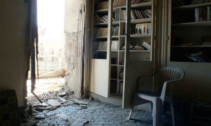 Damage is seen at the library of a school in al-Hamidiyeh district in Homs September 15, 2012. Tens of thousands of Syrians who moved into schools after air strikes and fighting drove them from their homes will be on the move again on Sunday when the government plans to start the school year despite unrelenting violence