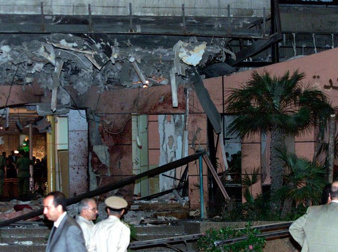 A May 17, 2003 file photo shows officials inspecting the damaged exterior of the Hotel Safir following a suicide bomb attack in Casablanca. German police have arrested a 37-year-old French citizen wanted by Moroccan authorities in connection with the 2003 bombings in Casablanca, authorities said in a statement October 31, 2012. The suspect was arrested at Munich airport on Monday after flying in from Paris with his family and intending to fly on to Dubai. Suicide bombers set off at least five explosions in Casablanca in May 2003, hitting a Spanish restaurant, a five-star hotel and a Jewish community centre. Forty-five people died, including 13 bombers. REUTERS/Joelle Vassort (MOROCCO - Tags: CRIME LAW POLITICS)