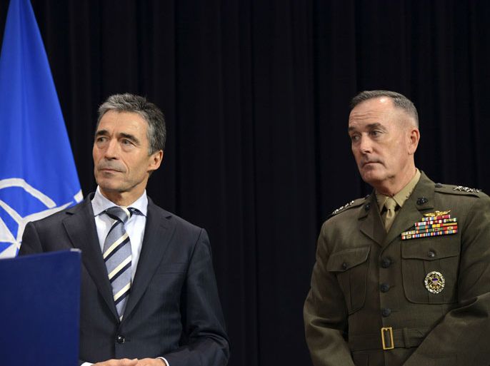 NATO Secretary General Anders Fogh Rasmussen, (L) and newly appointed ISAF Commander US General Joseph Dunford look on following a meeting of NATO Defense Ministers at NATO headquarter in Brussels on Otober 10, 2012. US General John Allen will take over as NATO supreme commander and be replaced as head of alliance forces in Afghanistan by Joseph Dunford, currently US Marine Corps deputy commander, US Defense Secretary Leon Panetta said Wednesday