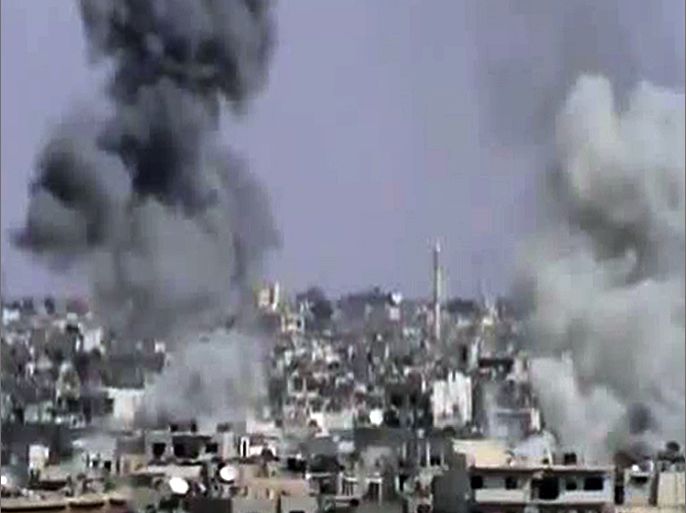 An image grab taken from a video uploaded on YouTube on October 5, 2012 allegedly shows smoke billowing following shelling by Syrian government forces in the central city of Homs . Warplanes pounded rebel-held areas of Homs in the Syrian city's heaviest onslaught for months , monitors said, as Turkey reportedly returned cross-border shellfire for the second time this week. AFP PHOTO/YOUTUBE == RESTRICTED TO EDITORIAL USE - MANDATORY CREDIT "AFP PHOTO/YOUTUBE" - NO MARKETING NO ADVERTISING CAMPAIGNS - DISTRIBUTED AS A SERVICE TO CLIENTS - AFP IS USING PICTURES FROM ALTERNATIVE SOURCES AS IT WAS NOT AUTHORISED TO COVER THIS EVENT, THEREFORE IT IS NOT RESPONSIBLE FOR ANY DIGITAL ALTERATIONS TO THE PICTURE'S EDITORIAL CONTENT, DATE AND LOCATION WHICH CANNOT BE INDEPENDENTLY VERIFIED ==