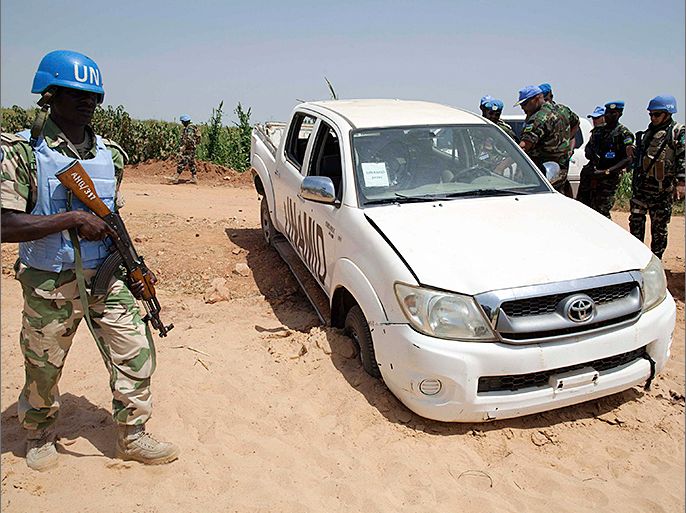 One of the United Nations-African Union Mission in Darfur (UNAMID) vehicles that was ambushed by unidentified assailants is seen at El Geneina, October 3, 2012. Four Nigerian peacekeepers were killed and eight wounded in an ambush in Sudan's western Darfur region, the international peacekeeper force UNAMID said on Wednesday. "They were killed last night some 2 km (1.2 miles) from our regional headquarters in El Geneina. They came under fire from all sides," a spokesman for UNAMID said. Picture taken October 3, 2012. REUTERS/United Nations-African Union Mission in Darfur/Albert Gonzalez Farran/Handout (SUDAN - Tags: POLITICS CIVIL UNREST TRANSPORT) FOR EDITORIAL USE ONLY. NOT FOR SALE FOR MARKETING OR ADVERTISING CAMPAIGNS. THIS IMAGE HAS BEEN SUPPLIED BY A THIRD PARTY. IT IS DISTRIBUTED, EXACTLY AS RECEIVED BY REUTERS, AS A SERVICE TO CLIENTS