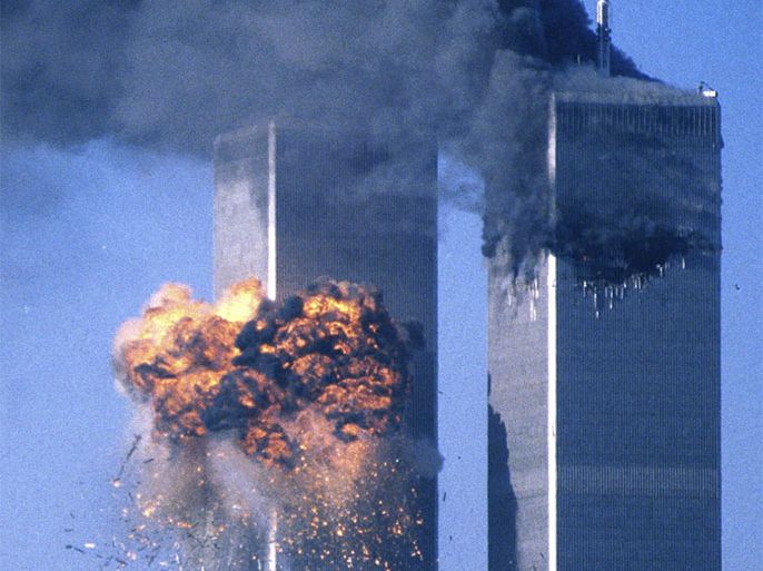 The World Trade Center south tower (L) bursts into flames after being struck by hijacked United Airlines Flight 175, as the north tower burns following an earlier attack, in New York City in this September 11, 2001 file photo. Al Qaeda leader Osama bin Laden was killed in a firefight with U.S. forces in Pakistan on May 1, 2011, ending a nearly 10-year worldwide hunt for the mastermind of the Sept. 11 attacks.