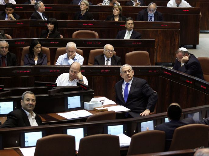 JERUSALEM, -, - : Israeli Prime Minister Benjamin Netanyahu (C-R) waits to address the opening of the winter session of the Knesset (Israeli parliament) in Jerusalem on October 15, 2012. The Israeli parliament was in session to vote on a motion to dissolve itself and clear the way for a snap election, likely to be set for January 22. AFP PHOTO/GALI TIBBON