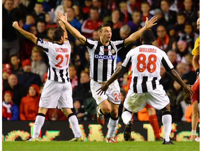 Udinese's Italian defender Giovanni Pasquale (C) celebrates after scoring the third goal during an UEFA Europa League football match between Liverpool and Udinese at Anfield in Liverpool, north-west England on October 4, 2012. AFP PHOTO / ANDREW YATES