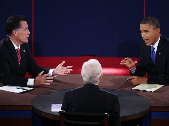 U.S. President Barack Obama (R) debates with Republican presidential candidate Mitt Romney as moderator Bob Schieffer listens at the Keith C. and Elaine Johnson Wold Performing Arts Center at Lynn University on October 22, 2012 in Boca Raton, Florida