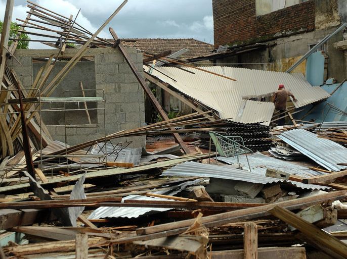 A man walks amid the destruction caused by hurricane Sandy in Cueto, Bayamo, 750 km east of Havana, on October 25, 2012. Hurricane Sandy claimed 11 lives as it tore across Cuba Thursday, leaving a path of destruction in the eastern part of the island, officials in Havana said