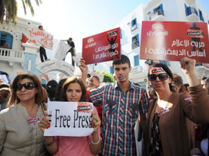 Tunisian Journalists protest during a strike on October 17, 2012 in the capital Tunis, after months of rising tensions with the Islamist-led government, which is accused of curbing press freedom and seeking to control public media groups. AFP PHOTO / FETHI BELAID