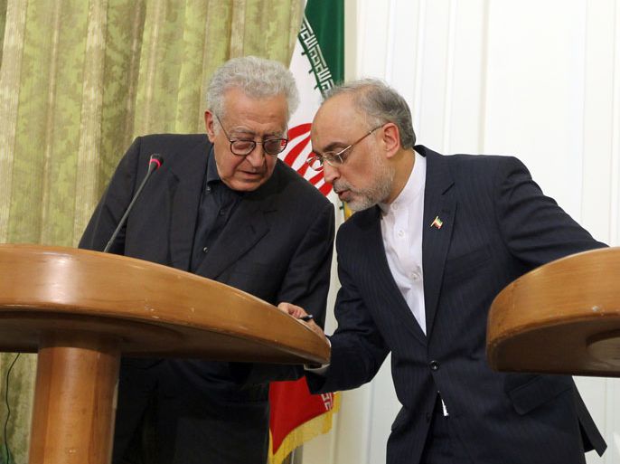 Iranian Foreign Minister Ali Akbar Salehi (R) and International Peace envoy to Syria Lakhdar Brahimi hold a joint press conference in Tehran , on October 14, 2012. With the violence raging in Syria, Brahimi is visiting Iran, the Syrian government's closest ally, after talks in Saudi Arabia and Turkey, the leading backers of the rebels who are fighting Syrian government forces. AFP PHOTO/ATTA KENARE