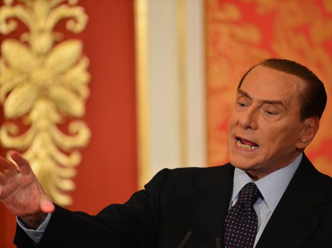 Italy’s former Prime Minister Silvio Berlusconi speaks during a press conference on October 27, 2012 at his residence, villa Gernetto in Lesmo, near Monza. Berlusconi said the same day he felt "obliged" to stay in politics to reform the justice system, the day after he was found guilty of tax fraud and sentenced to a year in prison.