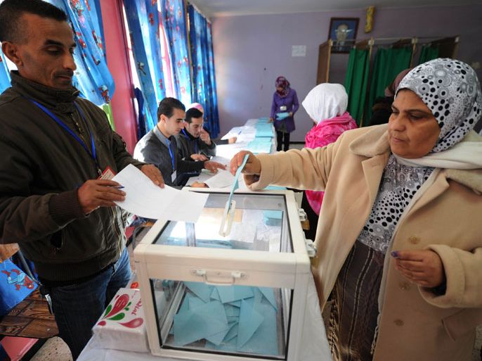 An Algerian woman casts her vote at a polling station in Algiers during local elections on November 29, 2012. Algeria's ruling party is eyeing a landslide victory in local elections, with numerous opposition groups warning of fraud in a poll that could struggle to mobilise a disaffected electorate