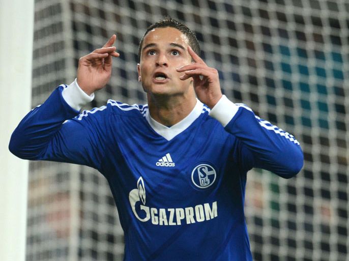 epa03452680 Schalke s Ibrahim Afellay celebrates scoring the 1-0 during the German Cup match FC Schalke 04 vs SV Sandhausen in Gelsenkirchen Germany 30 October 2012. (ATTENTION The DFB prohibits the utilisation and publication of sequential pictures on the internet and other online media during the match (including half-time). ATTENTION BLOCKING PERIOD! The DFB permits the further utilisation and publication of the pictures for mobile services (especially MMS) and for DVB-H and DMB only after the end of the match.) EPA/Bernd Thissen