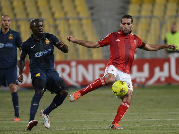 Egyptian Al-Ahly player Mohamed Aboutrika (R) vies for the ball with Tunis’s Yannick Ndjeng (2L) of Esperance de Tunis during their CAF Champions League final first leg football match in the Army Stadium in the town of Borg al-Arab, near Egypt's northern port city of Alexandria on November 4, 2012. AFP PHOTO/KHALED DESOUKI