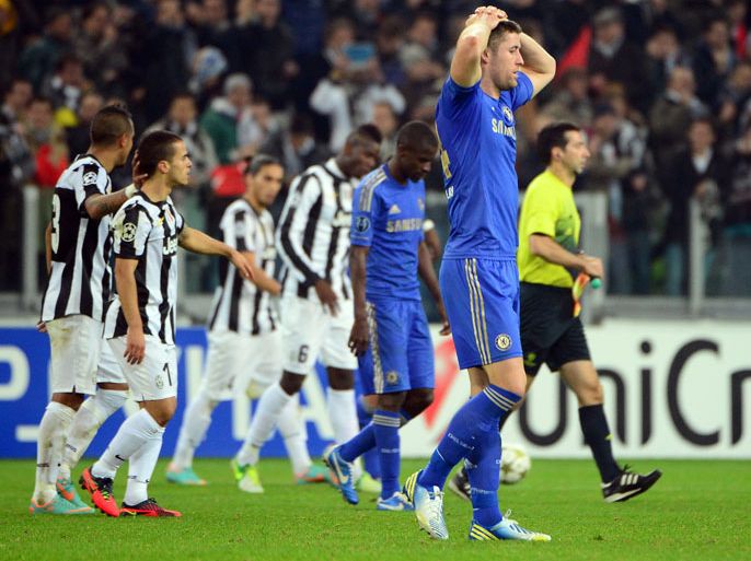 Chelsea's English defender Gary Cahill (R) reacts after the Champions League football match between Juventus and Chelsea on November 20, 2012 in the stadium of Alps in Turin. Juventus won 3-0. AFP PHOTO / OLIVIER MORIN