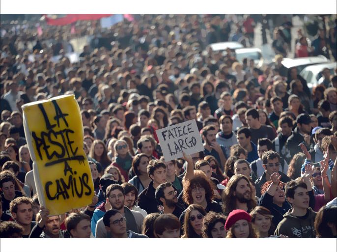 Students march during a demonstration against tax hikes on university fees and a cut in scholarships in the wake of the economic crisis on November 24, 2012 in Rome. AFP PHOTO / FILIPPO MONTEFORTE