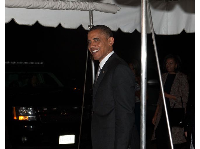 US President Barack Obama and his wife Michelle arrive at the White House in Washington on November 7, 2012 upon his return from Chicago, one day after his re-election