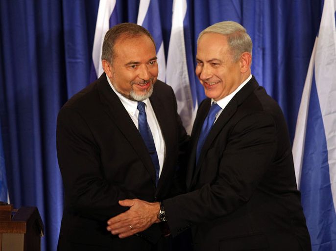 Israeli Prime Minister Benjamin Netanyahu (R) and Israeli Foreign Minister Avigdor Lieberman (L) shake hands after they announced that their parties Likud-Yisrael Beiteinu will unite for the 2013 election, during a press conference in Jerusalem, Israel, 25 October 2012. Israeli Prime Minister Benjamin Netanyahu's right wing Likud Party and Foreign Minister Avigdor Lieberman's Nationalist Yisrael Beteinu Party are to compete on a joint list in the next elections, the premier announced 25 October. In a brief televised news conference, Netanyahu said that uniting the two parties 'would give us the power to protect Israel from external threats, and the ability to generate economic changes.' Israel's elections are scheduled to take place January 22. Polls have forecast that Netanyahu will be re-elected