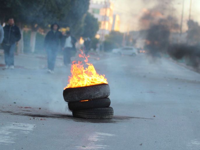 Tyres set on fire by protesters burn during clashes with police in Siliana November 28, 2012. At least 200 people were injured as Tunisians demanding jobs and economic development clashed with police on Wednesday, medical sources said, in the latest unrest to hit the country that spawned the Arab Spring uprisings. REUTERS