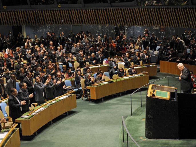 Mahmoud Abbas, President of the Palestinian Authority, gets a partial standing ovation after addressing the United Nations General Assembly before the body votes on a resolution to upgrade the status of the Palestinian Authority to a nonmember observer state November 29, 2012 at UN headquarters in New York. AFP PHOTO/Henny Ray Abrams
