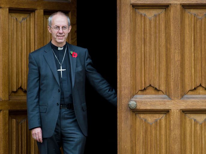 : The new Archbishop of Canterbury Justin Welby poses for pictures following a press conference in London, on November 9, 2012. Former oil executive Justin Welby was named Friday as the next Archbishop of Canterbury, the spiritual head of the world's Anglicans, in a move aimed at healing schisms over gay and female bishops
