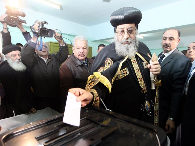epa03509256 Pope Tawadros II, leader of the Egyptian Coptic Orthodox Church casts his vote at a polling station during the referendum on a new constitution, in Cairo, Egypt, 15 December 2012. Polling places opened on 15 December in 10 of Egypt's provinces in the first round of a referendum on a draft constitution that has provoked demonstrations by pro- and anti-government protesters. EPA/KHALED ELFIQI