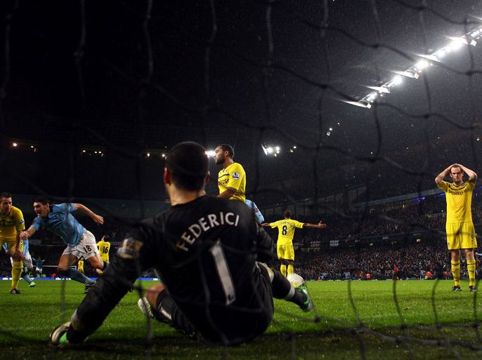 MANCHESTER, ENGLAND - DECEMBER 22: Gareth Barry of Manchester City runs to celebrate after scoring a header past Adam Federici of Reading during the Barclays Premier League match between Manchester City and Reading at Etihad Stadium on December 22, 2012 in Manchester, England. (Photo by Julian Finney/Getty Images)