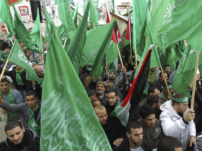 epa03508331 Palestinian supporters of Hamas attend a rally marking the 25th anniversary of the Islamist movement's foundation in the West bank town of Ramallah, 14 December 2012. Hamas held its first rally in the West Bank on 13 December, after a five-year ban, celebrating the 25th anniversary of its founding. The rally was made possible after the Palestinian Authority lifted the ban enforced since June 2007 when Hamas fighters took over the Gaza Strip after a short battle with Fatah-backed security forces. EPA/ATEF SAFADI
