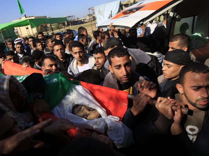 SK001 - RAFAH, GAZA STRIP, - : Palestinians carry the body of Mahmoud Jarghoun, 21, during his funeral in the town of Rafah in the southern Gaza Strip on December 1, 2012.