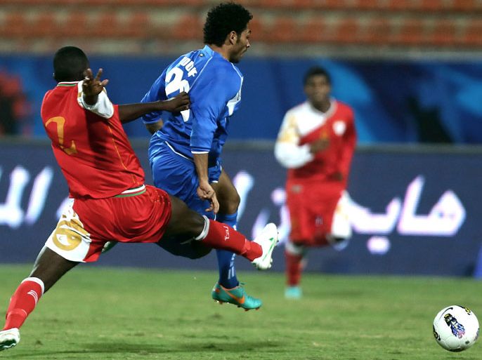 afp : Nadhir al-Maskari (L) of Oman vies for the ball against Yousef al-Sulaiman of Kuwait during their football match in the the 7th West Asian Football Federation (WAFF) championship in Kuwait City on December 11, 2012. AFP PHOTO/MARWAN NAAMANI