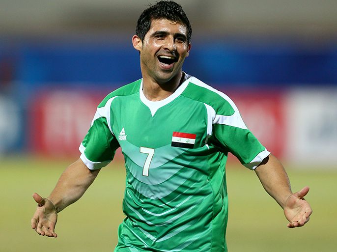 afp : Iraq's Hammadi al-Daea celebrates after scoring a goal against Jordan during their West Asian Football Federation (WAFF) championship football match in Kuwait City on December 10, 2012. AFP PHOTO/MARWAN NAAMANI
