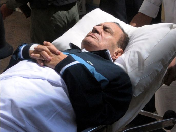 epa03519046 (FILE) A file photo dated 07 September 2011, shows former Egyptian president Hosni Mubarak on a stretcher while being taken to the courtroom for another session of his trial in Cairo, Egypt. According to Egyptian authorities on 27 December 2012, ousted president Mubarak was transferred from the prison where he is serving a life sentence to a military hospital for medical treatment, Egypt's state-run television reported. Mubarak ruled Egypt for three decades before being ousted in February 2011 following 18 days of street protests that gripped areas across Egypt. He is serving a life sentence after being accused of failing to prevent the killings of protesters in demonstrations in 2011. EPA/STR