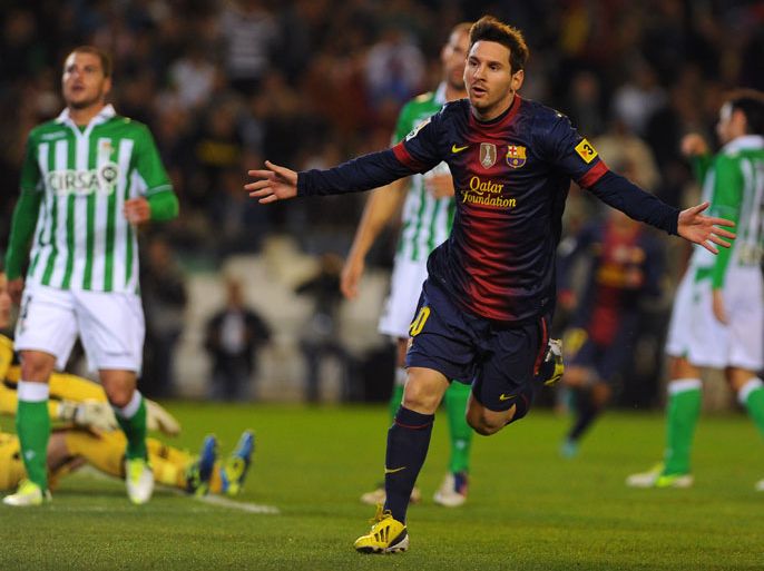 Barcelona's Argentinian forward Lionel Messi celebrates after scoring during the Spanish league football match Real Betis vs FC Barcelona on December 9, 2012 at the Benito Villamarin stadium in Sevilla. AFP PHOTO/ JORGE GUERRERO
