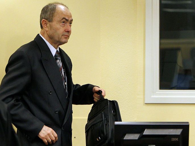 A file photo taken on February 26, 2010 shows former Bosnian Serb general Zdravko Tolimir arriving in the courtroom for the start of his trial before the International Criminal Tribunal for former Yugoslavia (ICTY) in the Hague. The UN Yugoslav war crimes court is to issue its verdict on December 12, 2012 against Tolimir, charged with genocide for his role in the 1995 Srebrenica massacre, the worst atrocity in Europe since World War II