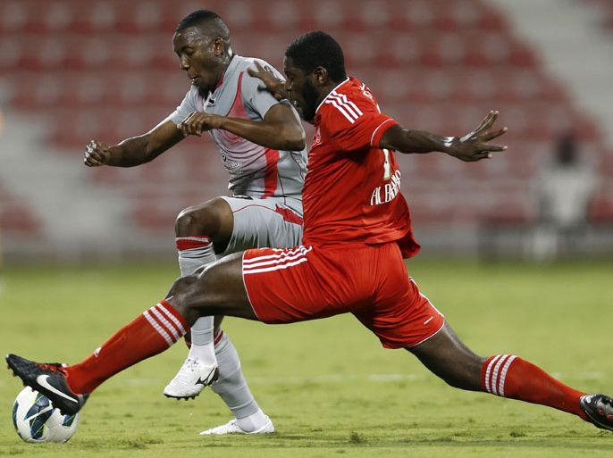 Lekhwaiya's Mohammed Mousa (L) fights for the ball with Al-Arabi's Mousa Ahmed during their Qatar Stars League match in Doha, December 1, 2012. REUTERS/Fadi Al-Assaad (QATAR - Tags: SPORT SOCCER)