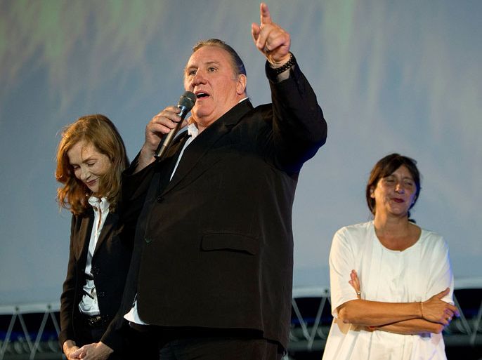 French actress Isabelle Huppert (L), Maurice Pialat's widow, French producer Sylvie Pialat (R) and French actor Gerard Depardieu (C) appear on stage for a tribute to late French director Maurice Pialat on the Piazza Grande during the 64th Locarno International Film Festival, in Locarno, Switzerland, 08 August 2011. EPA/JEAN-CHRISTOPHE BOTT EDITORIAL USE ONLY