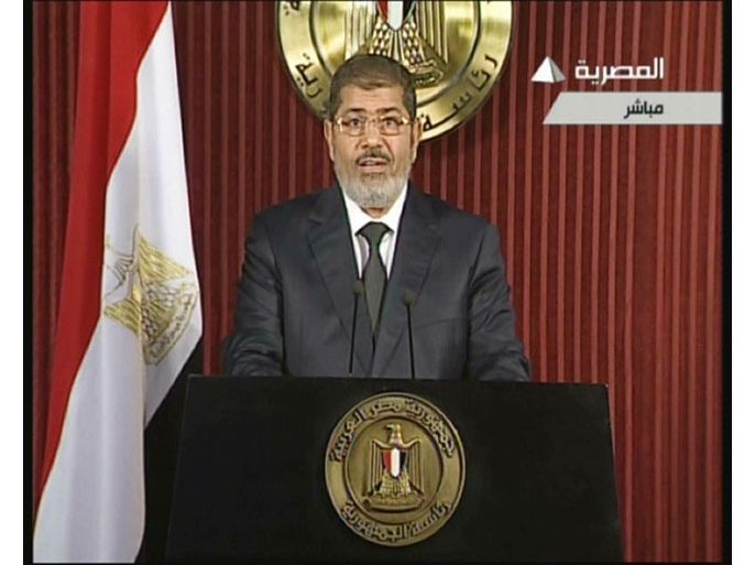 An image grab taken from Egyptian state TV shows Egyptian President Mohamed Morsi as he gives an address in Cairo on December 6, 2012, in his first speech since bloody street clashes between his supporters and opponents. AFP PHOTO/EGYPTIAN TV ==RESTRICTED TO EDITORIAL USE - MANDATORY CREDIT "AFP PHOTO / EGYPTIAN TV" - NO MARKETING NO ADVERTISING CAMPAIGNS - DISTRIBUTED AS A SERVICE TO CLIENTS ==