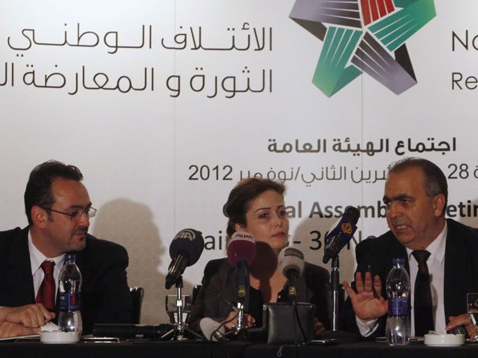 From R- L: Waleed Al-Bonni, a spokesman of the Syrian opposition government, Suheir Atassi (C), co-vice-president of the opposition government, and Khaled Al-Saleh, a member of the opposition coalition, address a news conference in Cairo December 1, 2012. The National Coalition of Syrian Opposition and Revolutionary Forces, which was formally announced in Doha on 11 November, held its first meeting in Cairo on Wednesday.