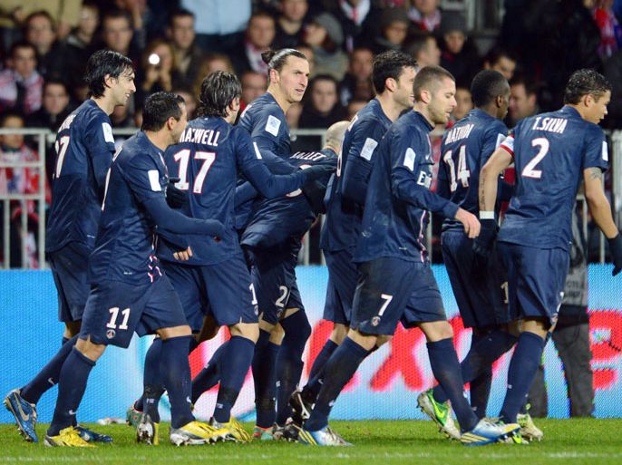 Paris's forward Zlatan Ibrahimovic (C) celebrates with teammates after scoring a goal during the French L1 football match Brest vs Paris Saint-Germain (PSG), on December 21, 2012 at the Francis Le Ble stadium in Brest, western France. AFP PHOTO / THOMAS BREGARDIS