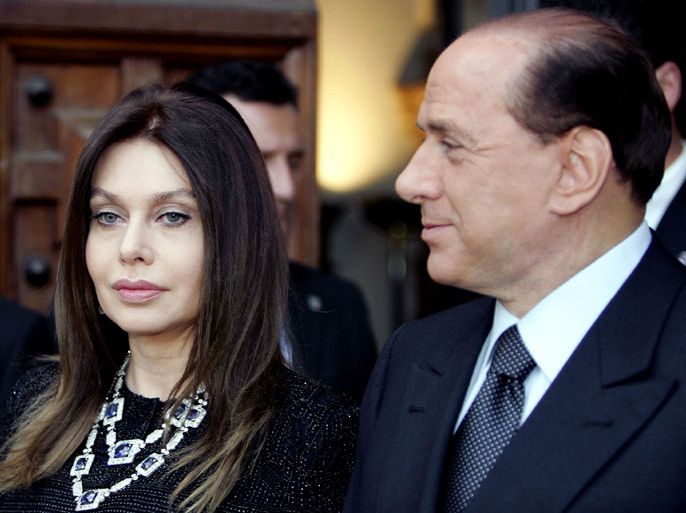 -, ITALY : File photo taken on June 4, 2004 shows then Italian Prime Minister Silvio Berlusconi (R) and his wife Veronica Lario in Rome. Silvio Berlusconi has been ordered by an Italian court to pay his second wife Veronica Lario three million euros ($3.95 million) a month alimony as part of a legal separation settlement which opens the way for their divorce, media reports said December 29, 2012. AFP PHOTO / Vincenzo PINTO