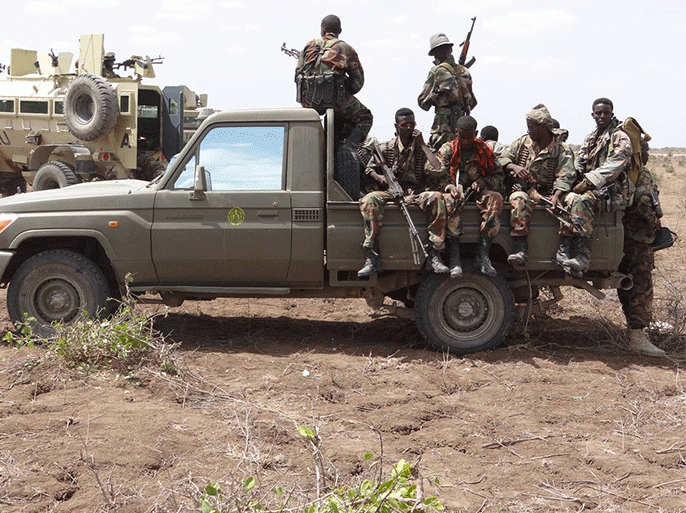 جنود حكوميون ومن قوات الاتحاد الإفريقي متوجدون في وقت سابق في منطقة غرسالة القريبة من جوهر