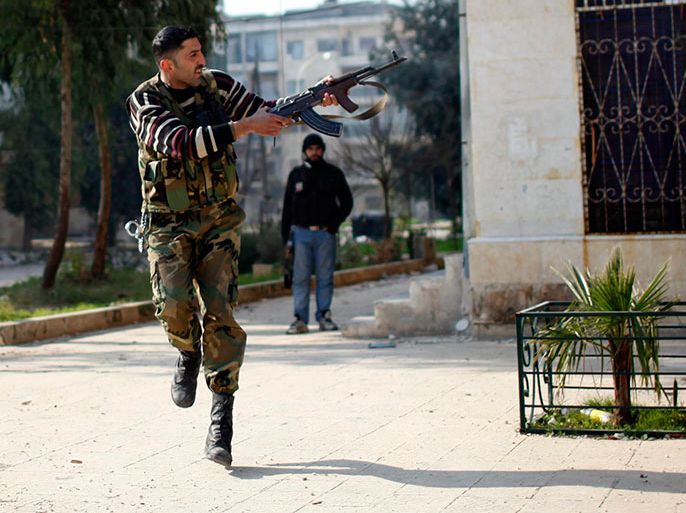 A Free Syrian Army fighter fires at a sniper loyal to Syrian President Bashar el-Assad during a fight on the front line in Aleppo city December, 31, 2012. REUTERS/Ahmed Jadallah (SYRIA - Tags: CIVIL UNREST POLITICS)