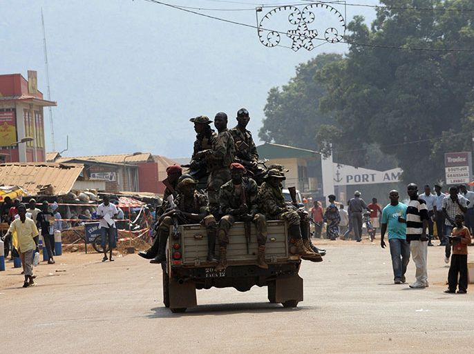 Central African soldiers patrol on January 5, 2013, in Bangui. Hopes that the conflict in the Central African Republic may be resolved through negotiation took a hit when rebels said on January 4 they had not been informed about plans for peace talks that have the support of the United States and the UN Security Council. The rebels have repeatedly questioned Centrafrican President Francois Bozize's sincerity in offering to form a government of national unity and called for him to leave power. AFP PHOTO/ SIA KAMBOU