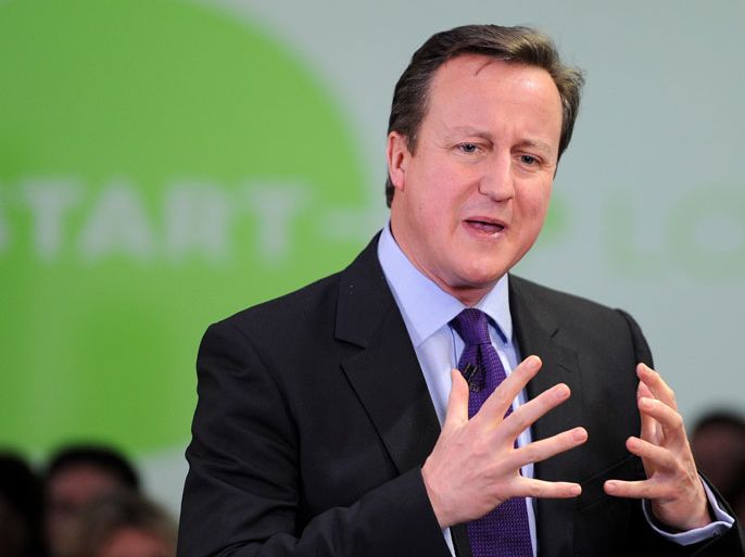 Britain's Prime Minister David Cameron speaks to entrepreneurs at a PM Direct event at The Media Factory in Preston on January 3, 2013. Cameron is on a visit to the North-west of England, during which he will be meeting business and enterprise people. AFP PHOTO/POOL/ MARTIN RICKETT