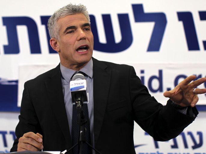 epa03550701 The newly elected , head of the Yesh Atid new Party Yair Lapid talking to his supporters after reading the sample results for the election results in Tel-Aviv, Israel, 22 January 2013. According to the television polls, Prime Minister Benjamin Netanyahu's Likud Beteinu party was projected to gain 31 seats, followed by Lapid Party Yesh Atid with 18 seats. EPA/ATEF SAFADI
