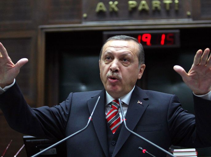 TURKEY : Turkey's Prime Minister Recep Tayyip Erdogan addresses members of parliament in Ankara on January 30, 2013. AFP PHOTO / ADEM ALTAN