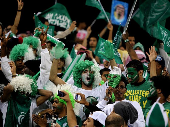 Saudi Arabian fans cheer prior to their team's match against Iraq in the 21st Gulf Cup in Manama, on January 6, 2013. AFP PHOTO/MARWAN NAAMANI