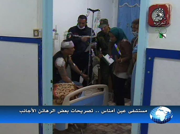 An image grab taken from footage broadcast by Algeria's Al-Jazairia 3 TV on January 18, 2013 shows medics attending to a wounded hostage at a hospital after he fled his Islamist captors following a deadly commando raid by Algerian forces at a desert gas field in In Amenas. Algerian special forces have freed nearly 650 hostages from Islamist gunmen at the remote gas plant near the Libyan border, but some 60 foreigners are still missing, national media said. AFP PHOTO/AL-JAZAIRIA 3 TV