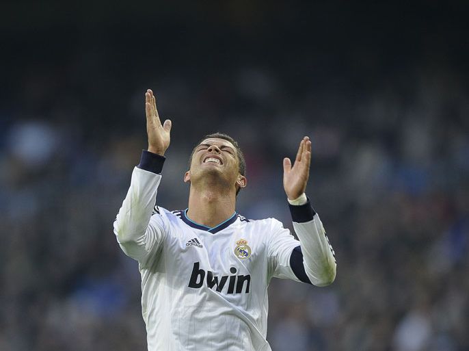 Real Madrid's Portuguese forward Cristiano Ronaldo reacts during the Spanish league football match Real Madrid vs Real Sociedad at the Santiago Bernabeu stadium in Madrid on January 6, 2013. AFP PHOTO / PEDRO ARMESTRE