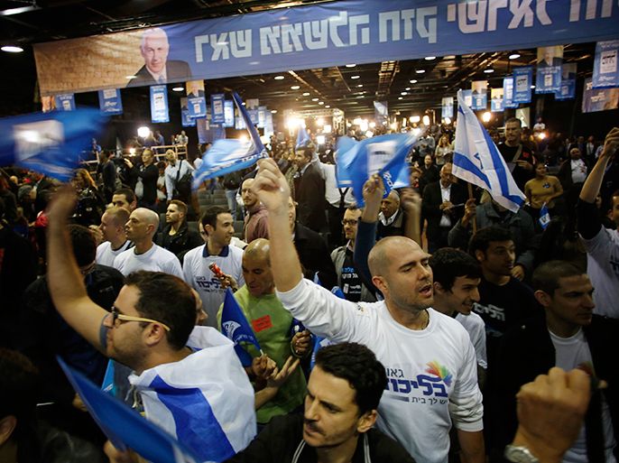 Supporters of Prime Minister Benjamin Netanyahu's Likud party celebrate after the exit polls were announced at the party's headquarters in Tel Aviv January 22, 2013. Prime Minister Benjamin Netanyahu's rightist Likud-Beitenu party came out on top in Israel's election on Tuesday, exit polls said, but centre-left parties made surprising gains, potentially complicating coalition building. REUTERS/Baz Ratner (ISRAEL - Tags: POLITICS ELECTIONS)