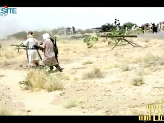 This handout photo of a video grab provided by the SITE Monitoring Service on January 10, 2013 and posted on January 9 on jihadist forums by a group calling itself "al-Sahara Media Foundation" reportedly shows al-Qaeda in the Islamic Maghreb (AQIM) fighters preparing for war in northern Mali. Malian troops exchanged fire on January 9, 2013 with armed Islamist groups that have been occupying the country's vast desert north for nine months and appear to be trying to push farther south. The latest clashes, which a resident said included heavy-weapons fire, came less than 48 hours after the west African nation's army put down an attempted Islamist attack on the same town, Konna, which is located near the edge of the government-controlled zone and the regional capital of Mopti, the gateway to the south. AFP PHOTO / SITE Monitoring Service